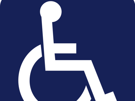 Zu sehen ist ein Rollstuhlpiktogramm in weiß auf blauem Hintergrund